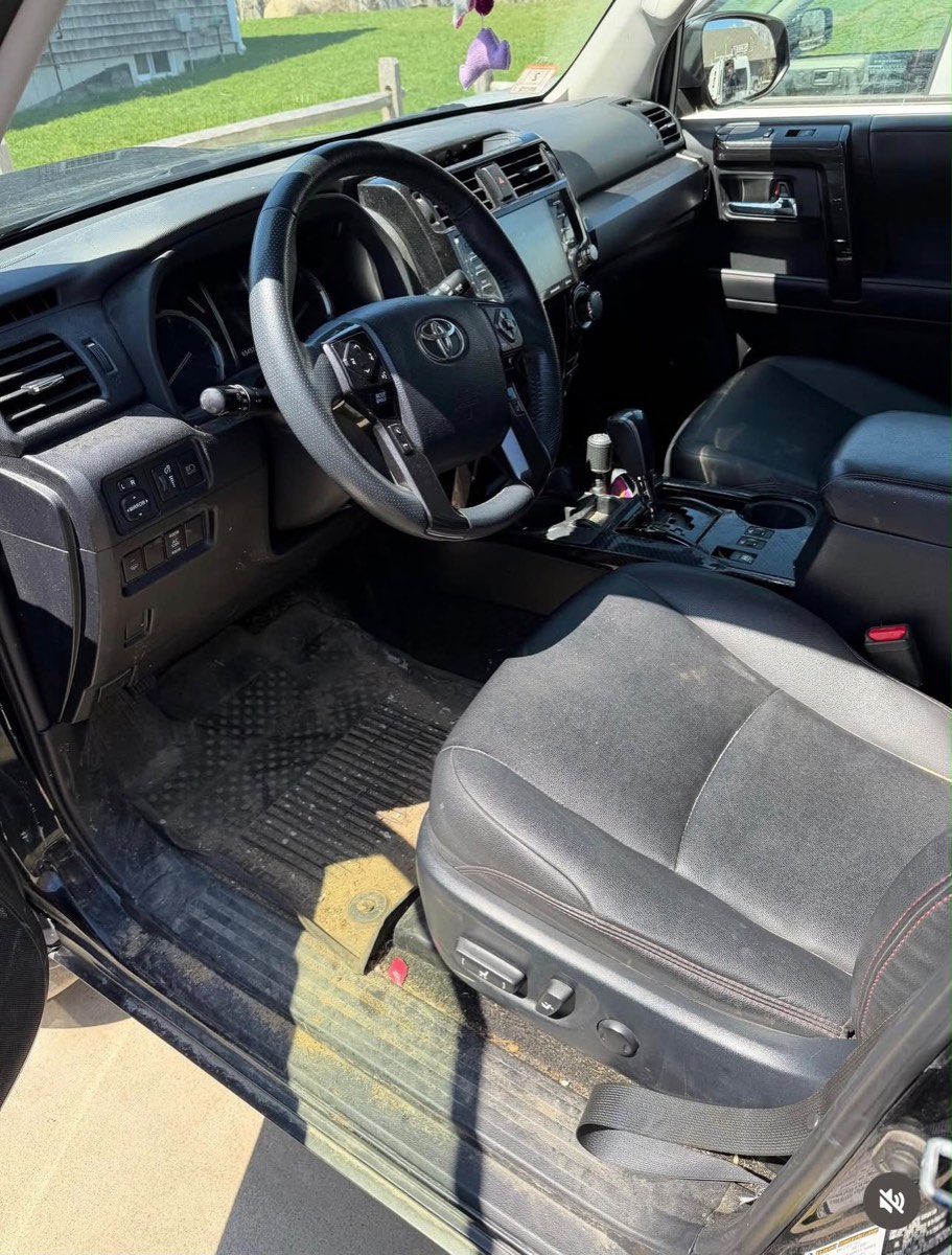 Toyota 4Runner interior before detailing — dusty mats and seats